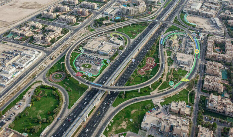 Aerial view of JVC Dubai showing metro access, bus stops, and major highways for commuter routes.