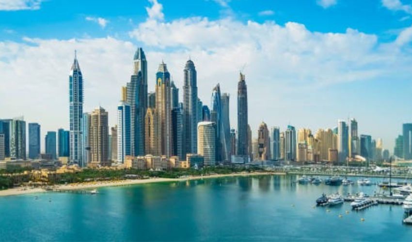 Dubai Marina's waterfront featuring yachts and high-rise buildings.