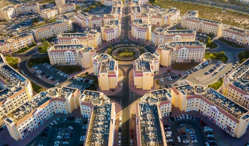 International City's residential buildings with varied designs.