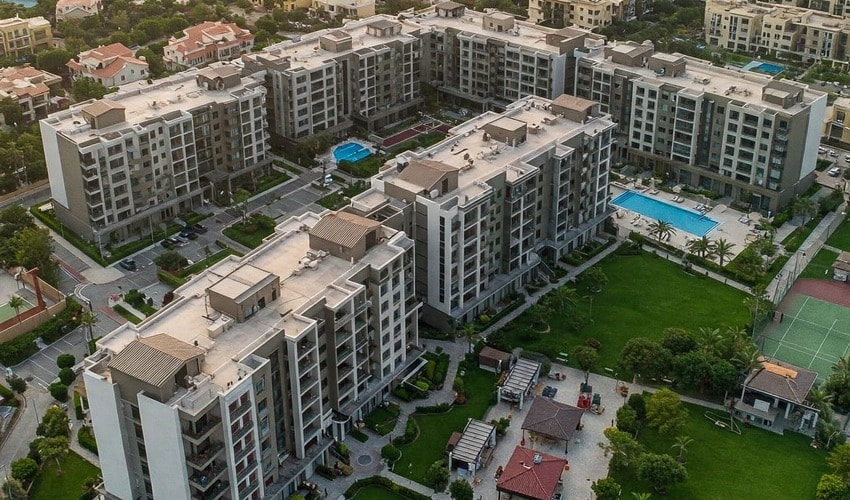 Modern apartment buildings in Jumeirah Village Circle (JVC), ideal for real estate investment.