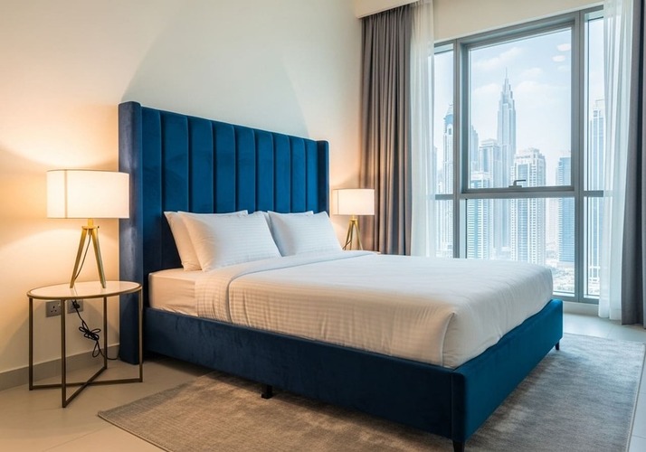 Bedroom with south‑facing bed headboard and soft lighting—Vastu sleep harmony
