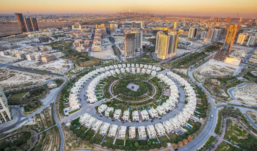Aerial view of Jumeirah Village Circle showing main exits and road connections to Al Khail Rd and SMBZ Rd in 2025.