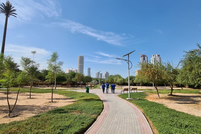 Khansoor Park JVC jogging track runner exercising fitness Dubai rubberized running path green space lifestyle
